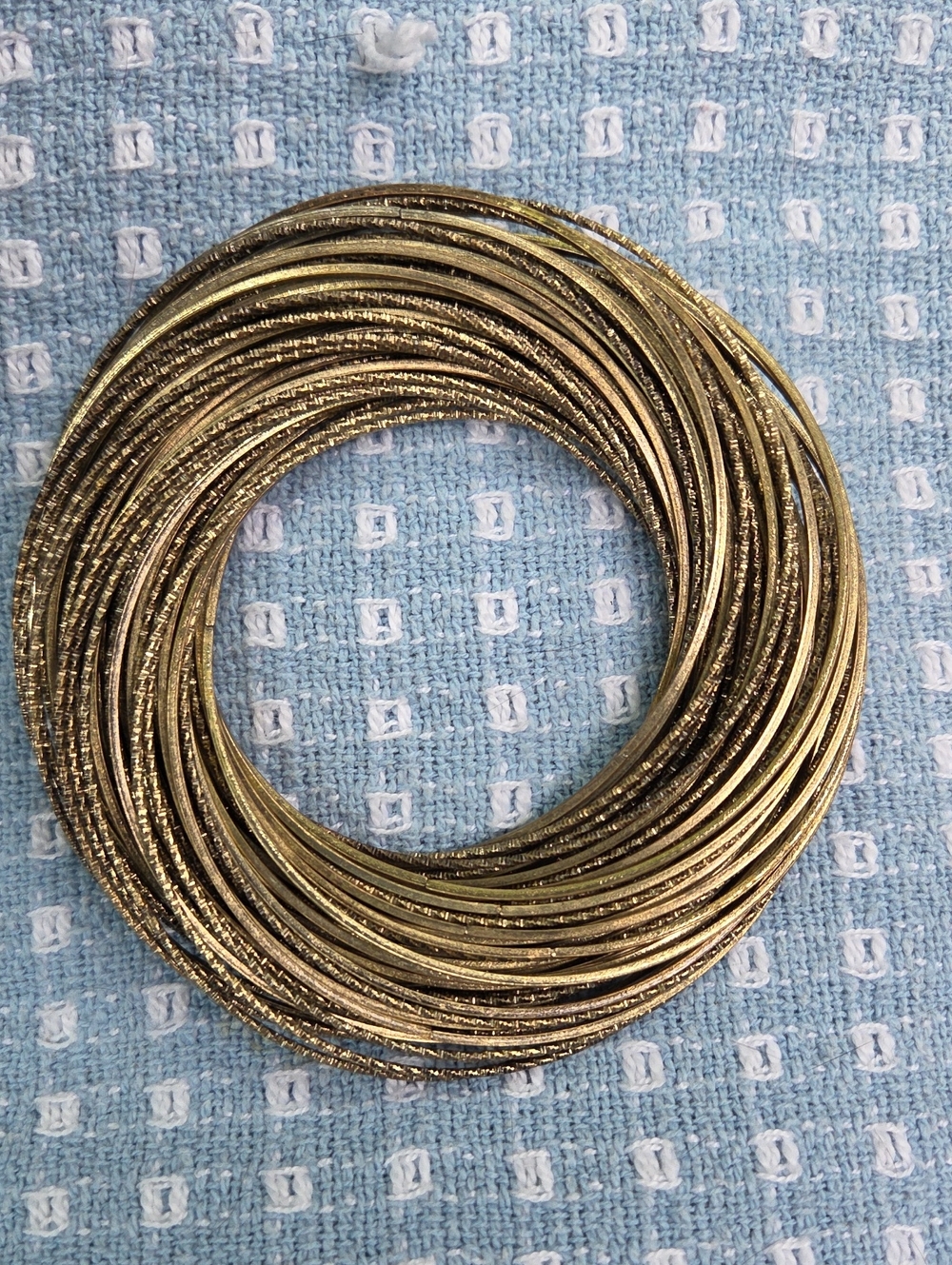 Multi-Strand Stack Of 80 Single Interlocking Bracelets.